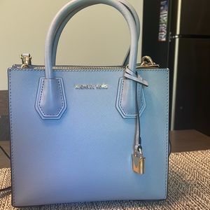 Michael Kors light blue satchel bag with detachable strap.